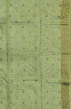 Load image into Gallery viewer, Desingers tissue saree with floral patterns all over and tasselled pallu and blouse.
