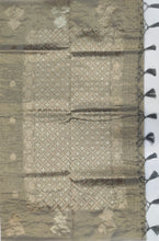 Load image into Gallery viewer, Desingers tissue saree with floral patterns all over and tasselled pallu and blouse.
