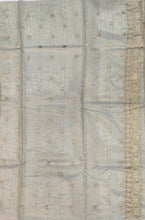 Load image into Gallery viewer, Desingers tissue saree with floral patterns all over and tasselled pallu and blouse.
