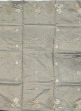 Load image into Gallery viewer, Desingers tissue saree with floral patterns all over and tasselled pallu and blouse.
