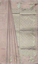 Load image into Gallery viewer, Desingers tissue saree with floral patterns all over and tasselled pallu and blouse.
